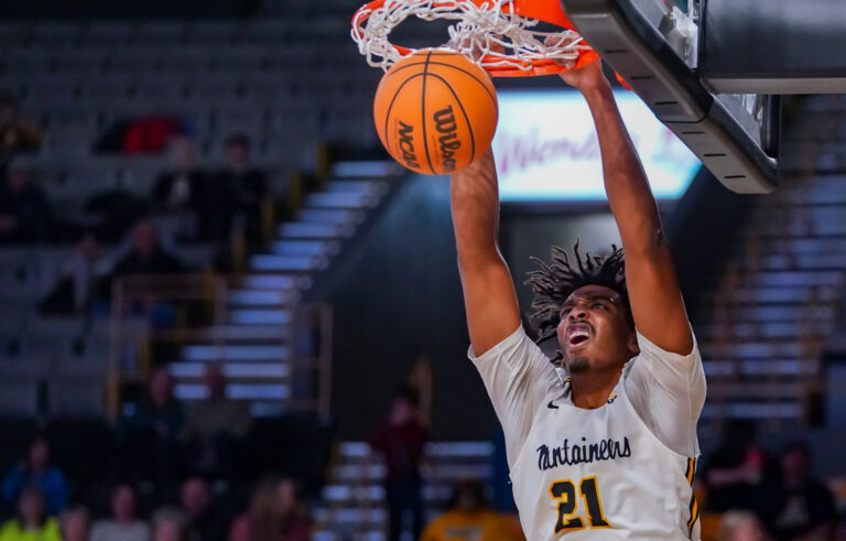 Throttled down, but Marshall prevails over Mountaineers, 66-58