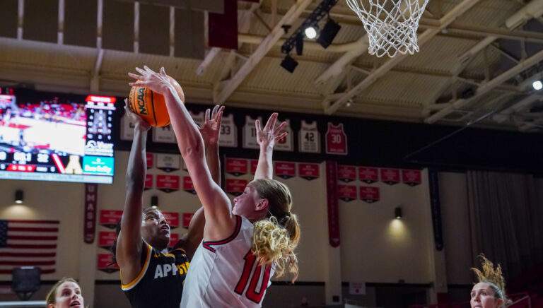 Wildcats block Mountaineers, 64-41